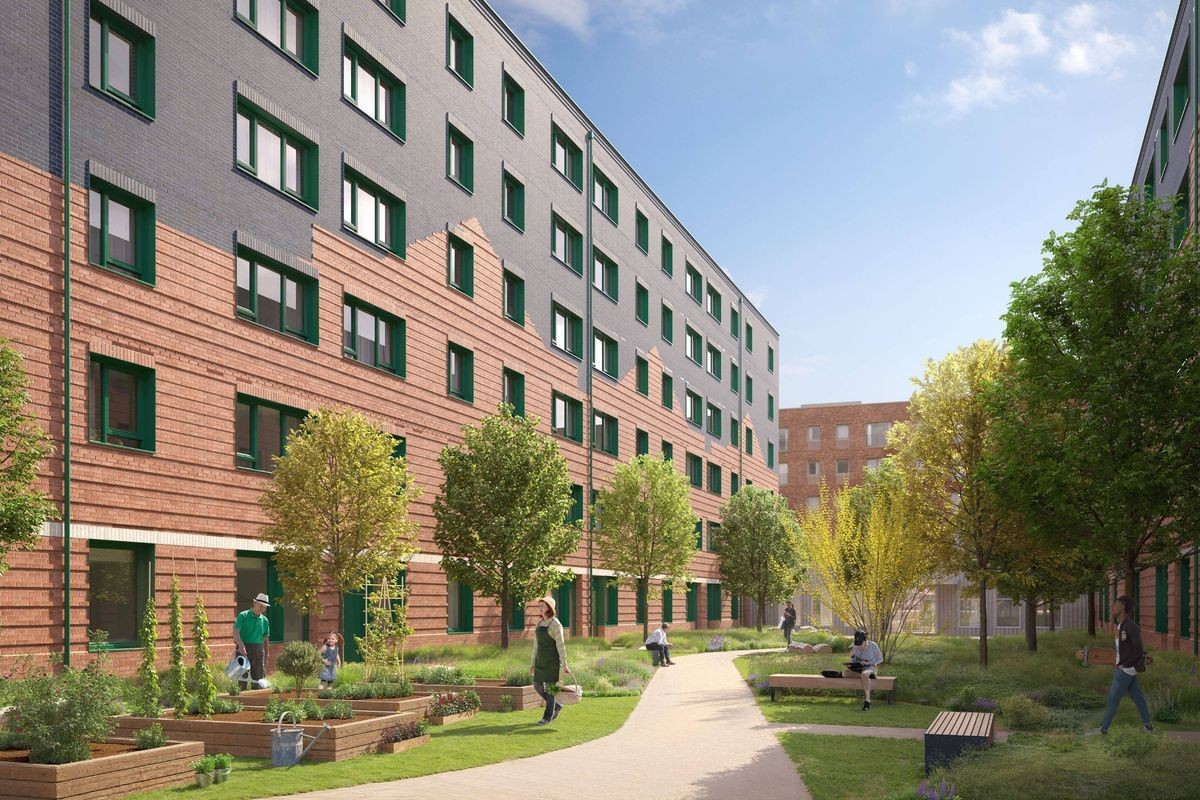 CGI of new homes on former Norton Park car park, which is a landscaped courtyard between two modern mid-rise buildings with brick and grey facades. The space features young trees, raised planting beds, grassy areas, and a winding light‑coloured pathway. Several people are walking or sitting on benches throughout the courtyard, and the scene is bright and sunny with a clear sky.