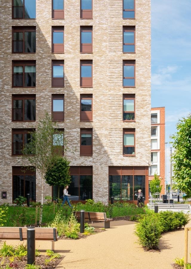 Multi floor building, with people walking outside