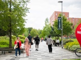 People walking around the University of Salford campus
