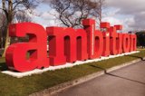 Sculpture of the word ambition outside the University of Salford