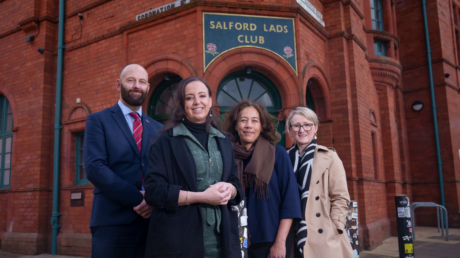 Paul Dennett Salford City Mayor, Rebecca Long-Bailey MP and two other women outside Salford Lads and Girls Club